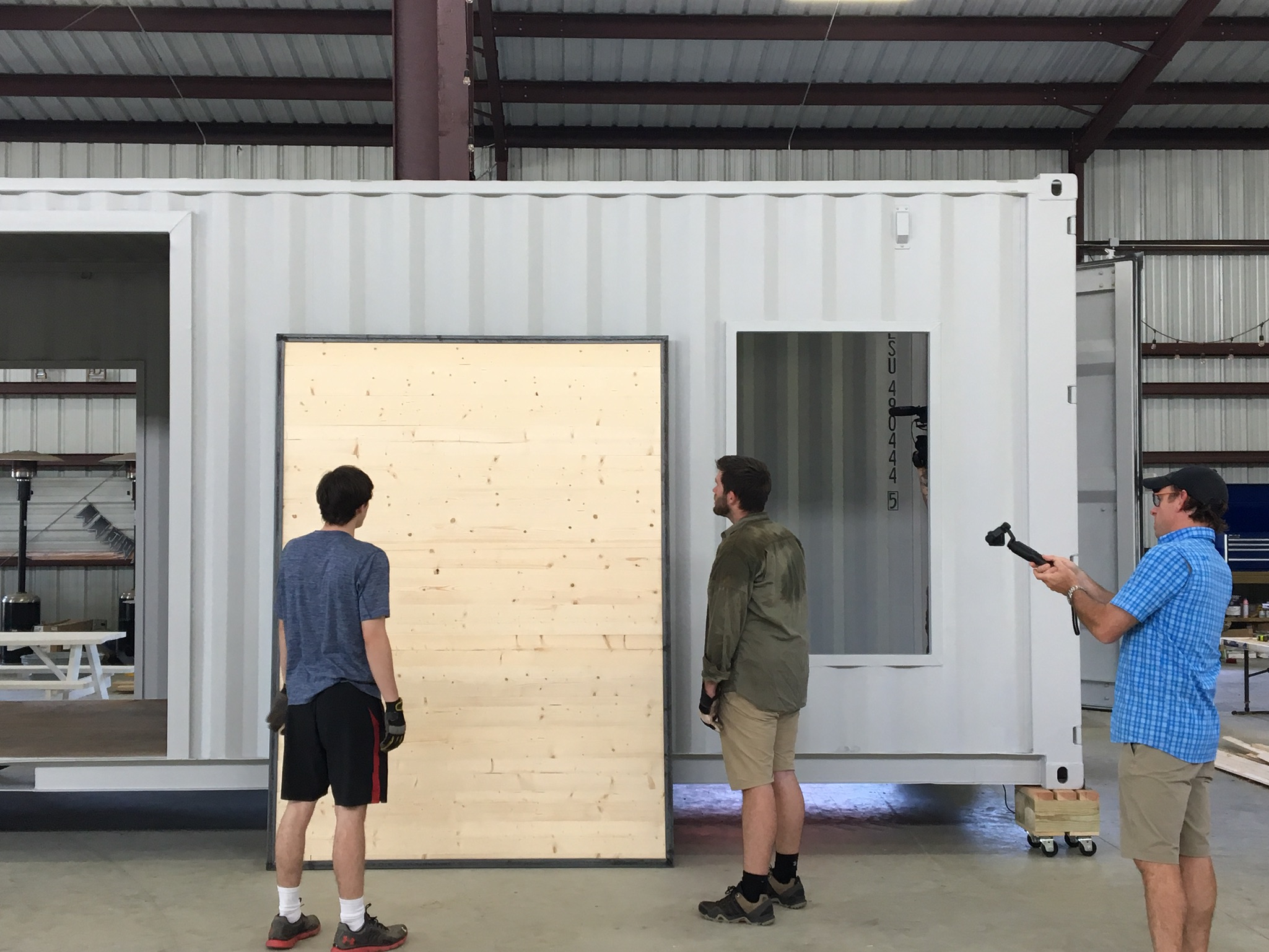 workers making home from container