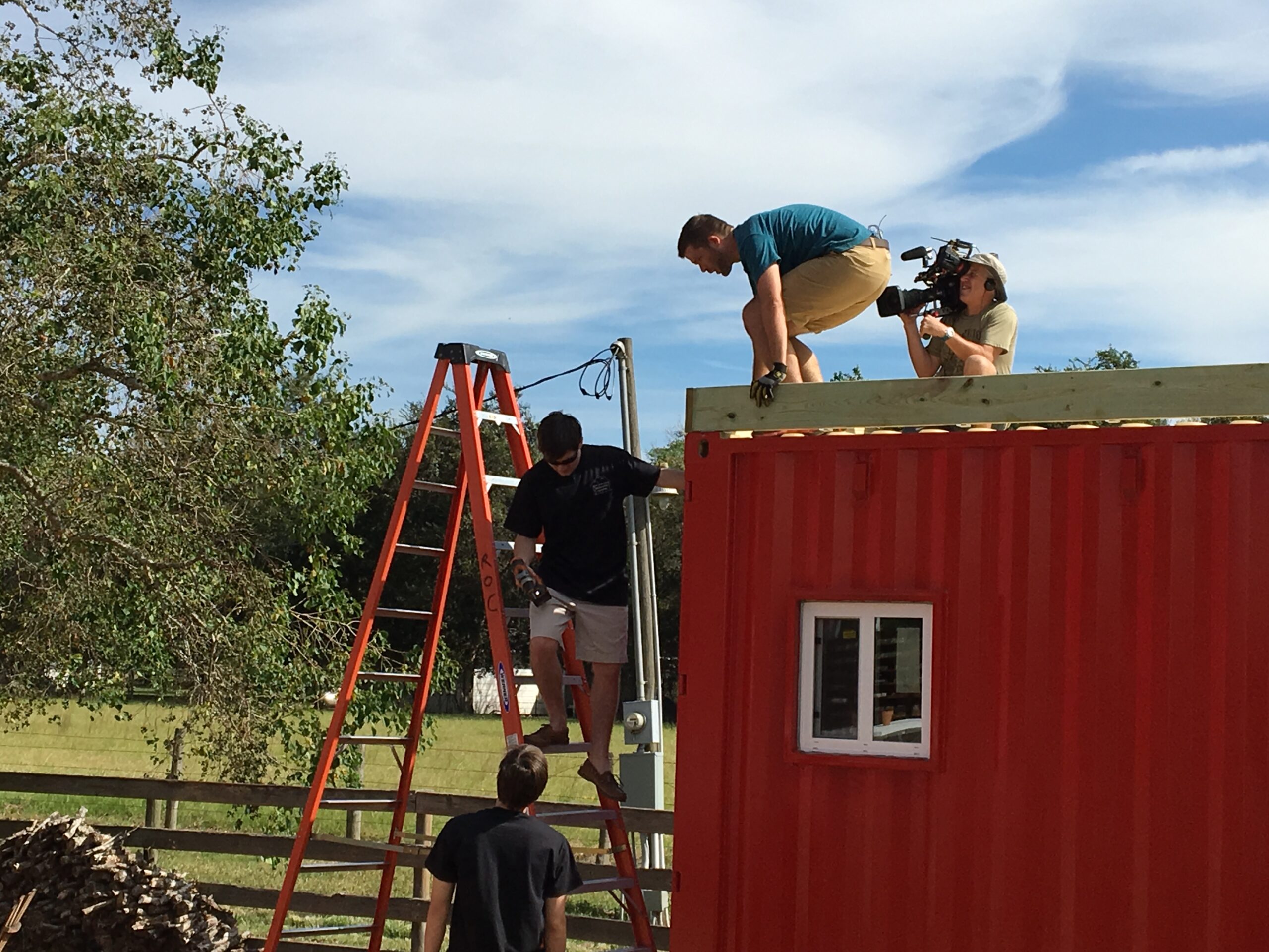workers making home from container
