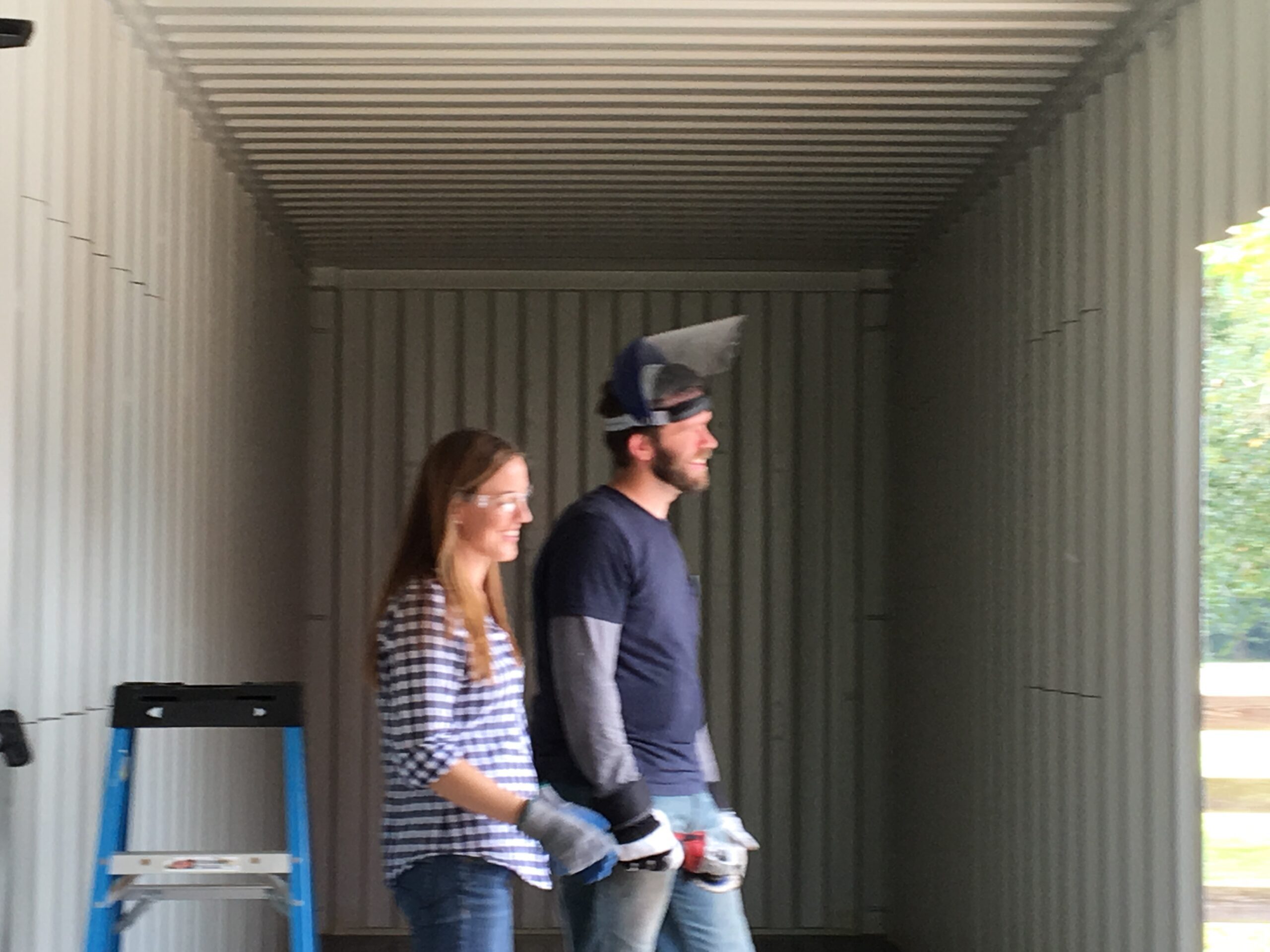 couple making home from container